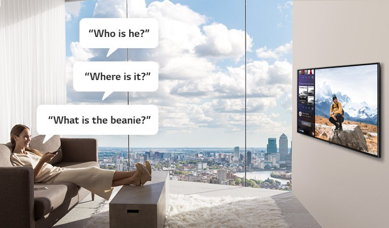 A Woman watching and asking TV, "Who is he?", "Where is it?", and "What is the beanie?" 