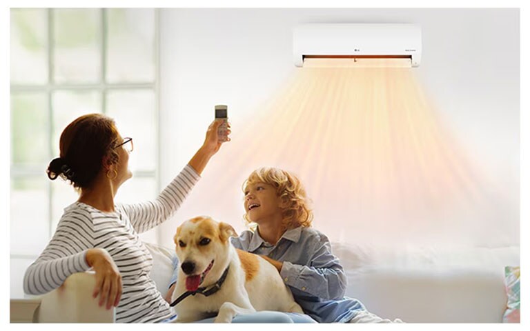 A grandmother and grandson are lying on the sofa and getting a warm breeze