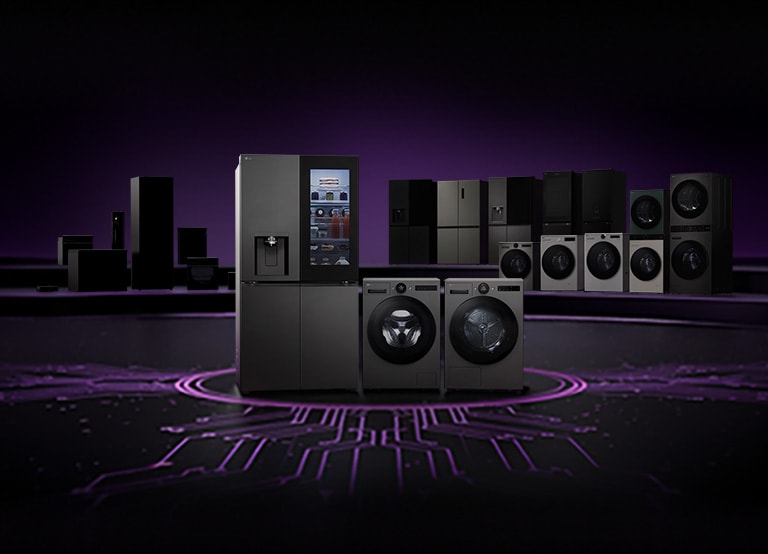 Lineup of LG home appliances including refrigerators, washing machines, dryers, and kitchen appliances displayed on a dark stage with a circuit board pattern floor	