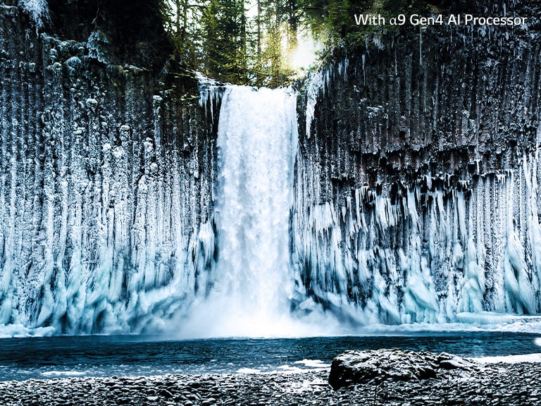 Slider comparison of picture quality of a frozen waterfall in a forest.