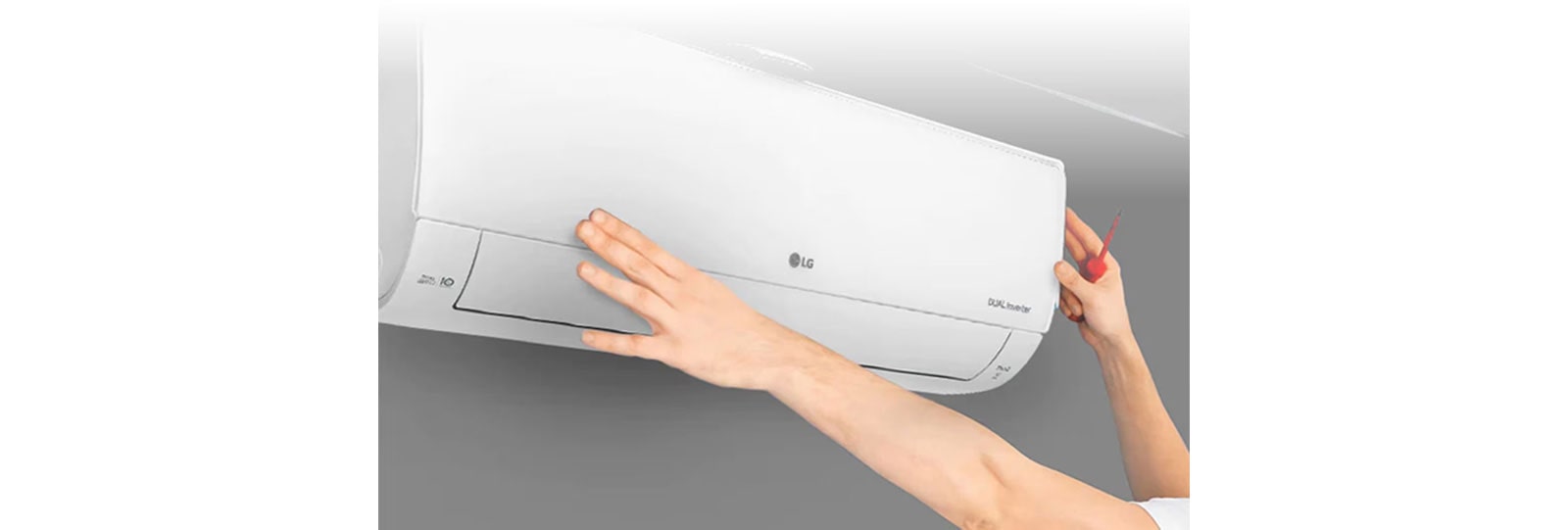 The repairman is repairing the air conditioner.