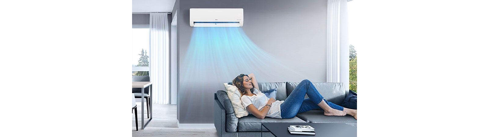 A woman resting on a sofa in the cool breeze of the air conditioner