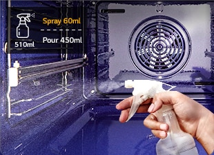An image of spraying water on the oven wall with a sprayer.