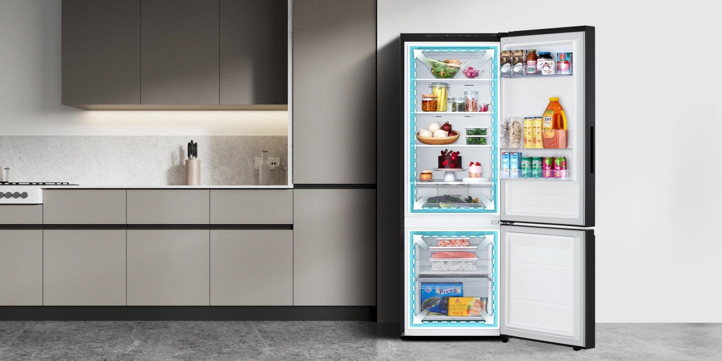 A lg bottom freezer refrigerator with increased in total volume and neatly organized shelves filled with various foods and beverages.