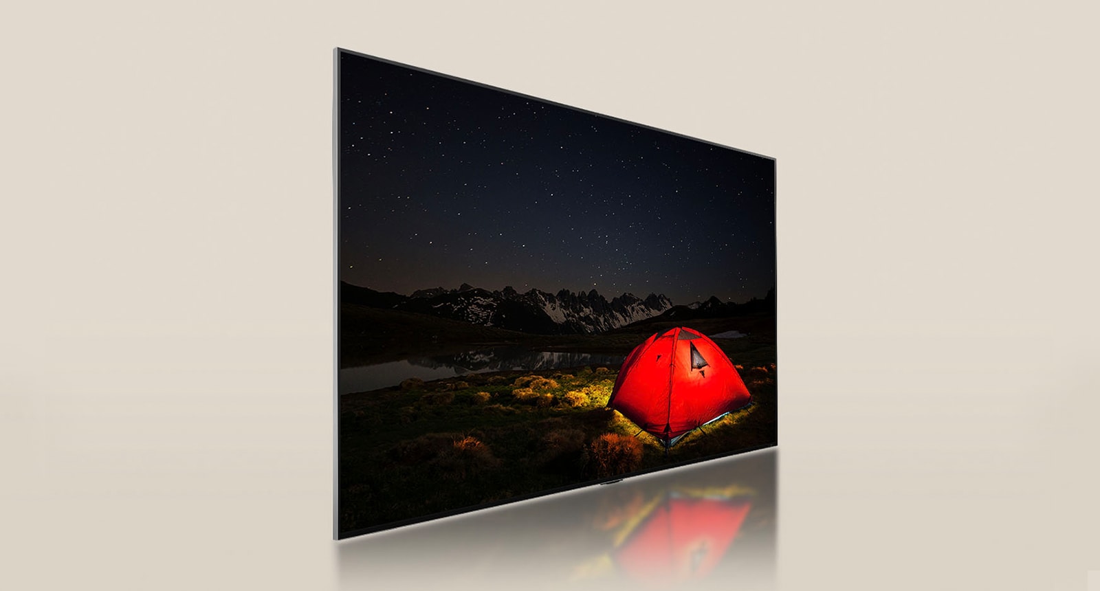 Televisor LG con pantalla tenue que muestra una noche oscura con una carpa de color rojo brillante. Un panel de luz de fondo azul se divide detrás del televisor. Pequeños bloques de atenuación se encuentran dispersos por el panel. Luego, el panel y el televisor se fusionan para hacer que la pantalla se vuelva más brillante y clara.