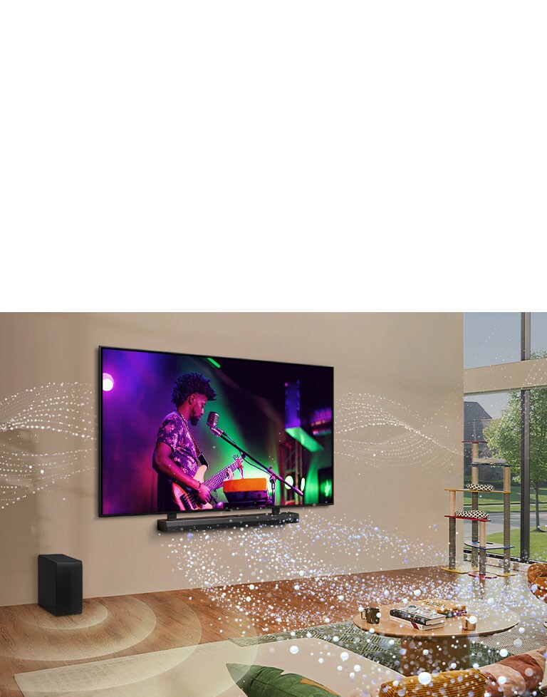 Uma imagem da TV da LG e uma soundbar instaladas na parede de uma sala de estar com gráficos de formas brilhantes ao redor da sala.