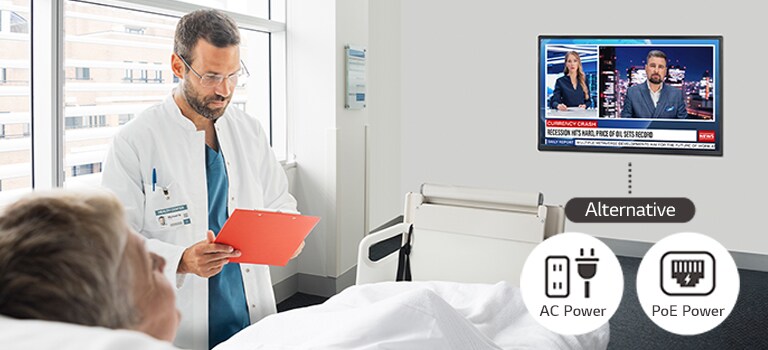 A patient is lying in the hospital room and watching a TV installed on the wall. The TV can be operated with AC power or PoE power.