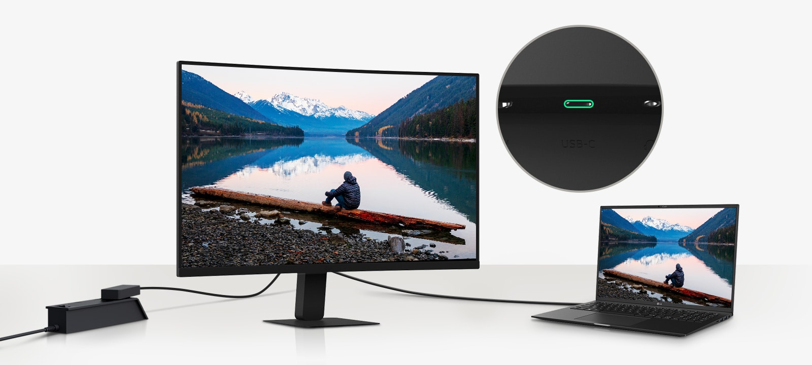 Imagen de una computadora portátil y un monitor conectados con un solo cable USB-C.