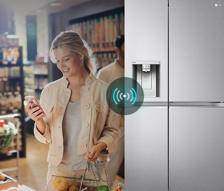 The image on the left shows a woman standing in a grocery store looking at her phone. The image on the right shows the front view of the refrigerator. In the center of the images there is an icon to show the connectivity between the phone and the refrigerator.