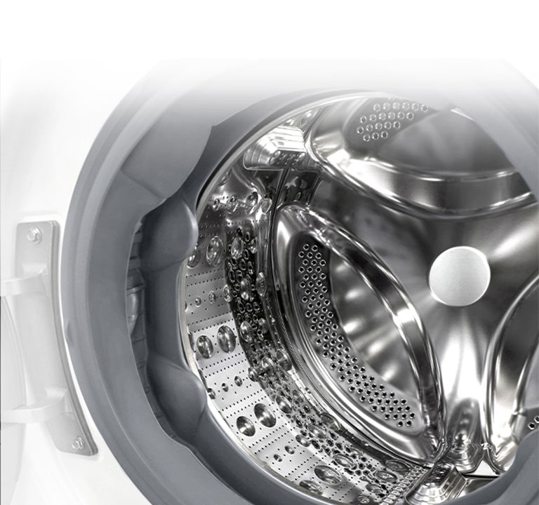 Vaade pesumasina sisemusse, millest paistab roostevabast terasest tõstuk.