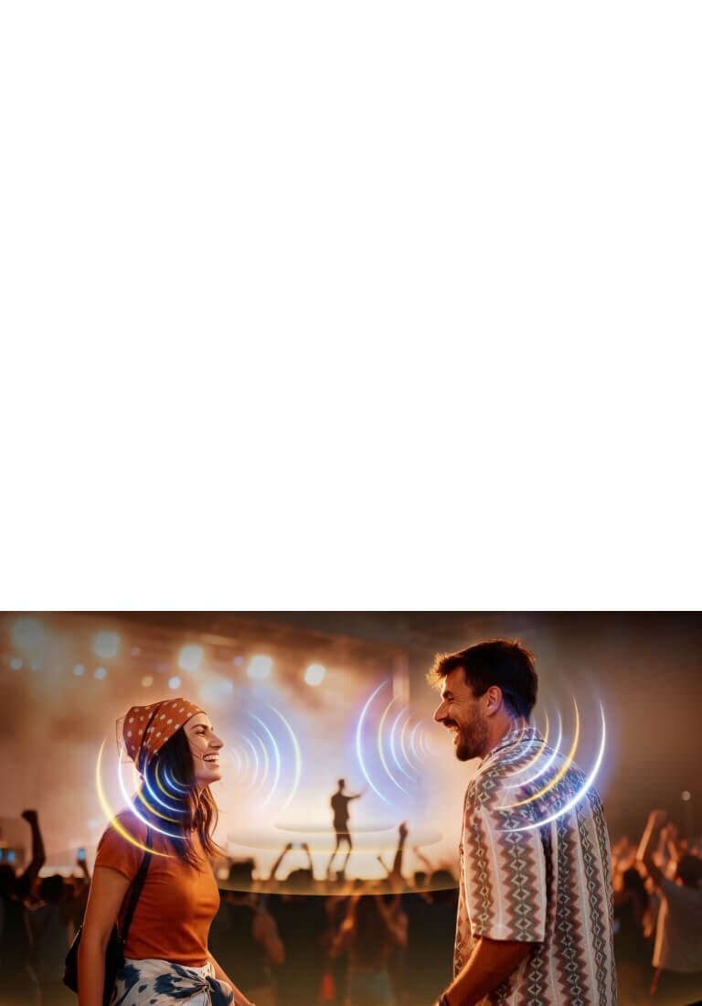 LG OLED evo AI C6 with AI Object Remastering Ultra shows two people facing each other at a crowded concert, clarifying voices amid loud background noise and delivering crystal-clear, immersive audio.