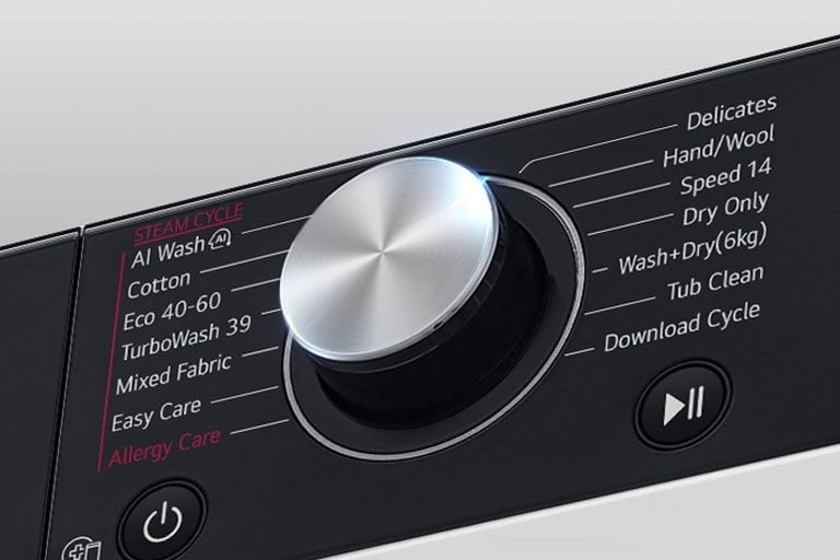 See on suurendatud kujutis pesumasina paneelil olevast metallnupust.