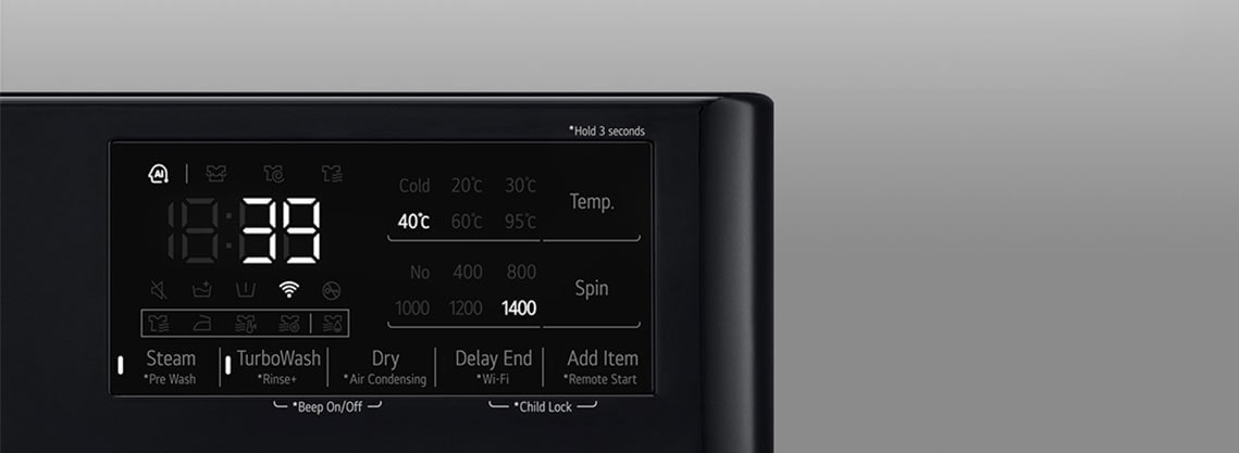 See on suurendatud kujutis pesumasina paneelil olevast metallnupust.