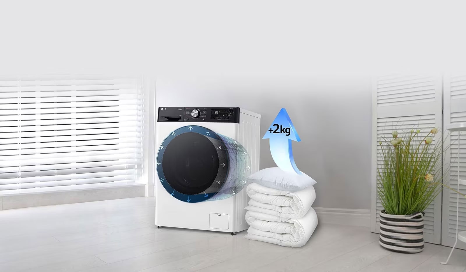 Tekid ja padjad on pesumasina kõrval ning padjal on nool, mis tõstab mahtu 2 kg võrra.