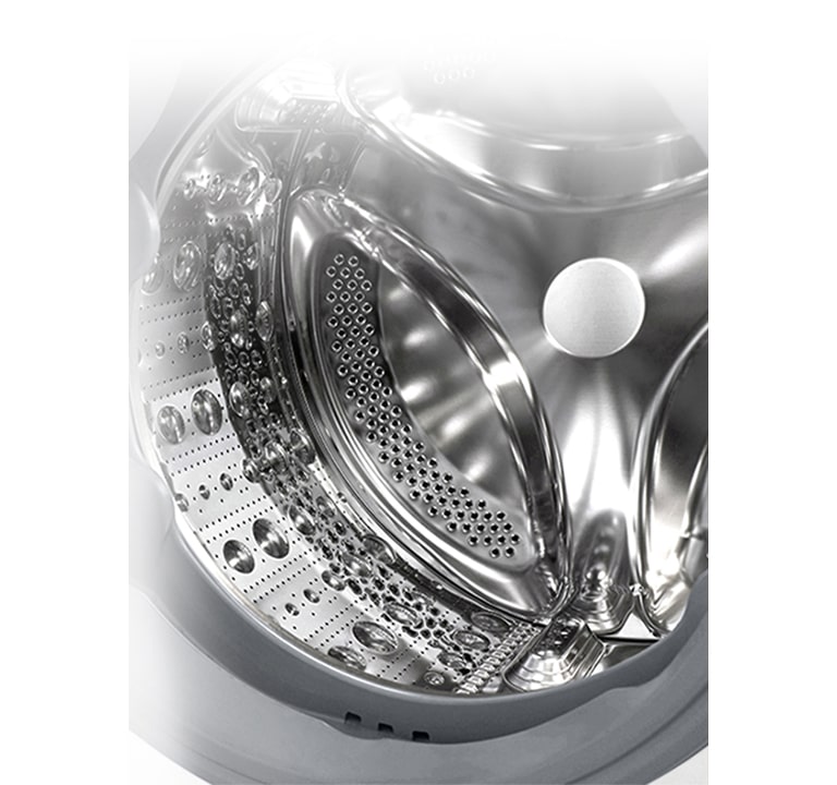 Vaade pesumasina sisemusse, millest paistab roostevabast terasest tõstuk.