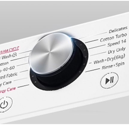 See on suurendatud kujutis pesumasina paneelil olevast metallnupust.