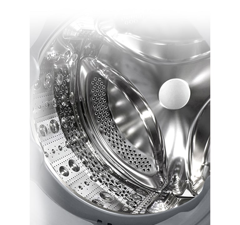 Vaade pesumasina sisemusse, millest paistab roostevabast terasest tõstuk.