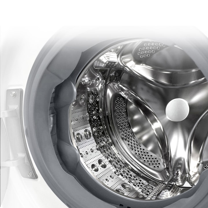 Vaade pesumasina sisemusse, millest paistab roostevabast terasest tõstuk.