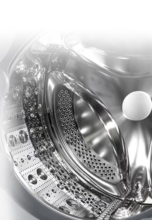 Vaade pesumasina sisemusse, millest paistab roostevabast terasest tõstuk.