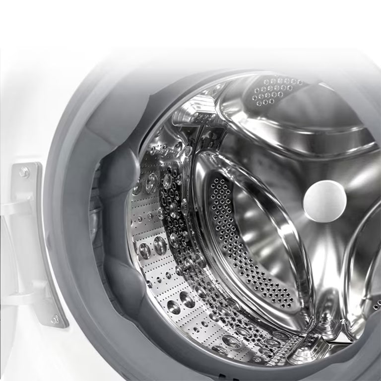 Vaade pesumasina sisemusse, millest paistab roostevabast terasest tõstuk.