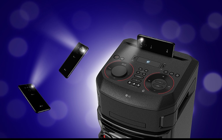 Pealt lähivaade LG XBOOMile Selle ümber hõljuvad kaks vilkuvat mobiiltelefoni.