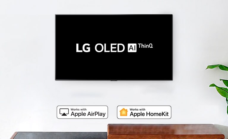 Wall-mounted TV showing LG OLED AI ThinQ logo on black background