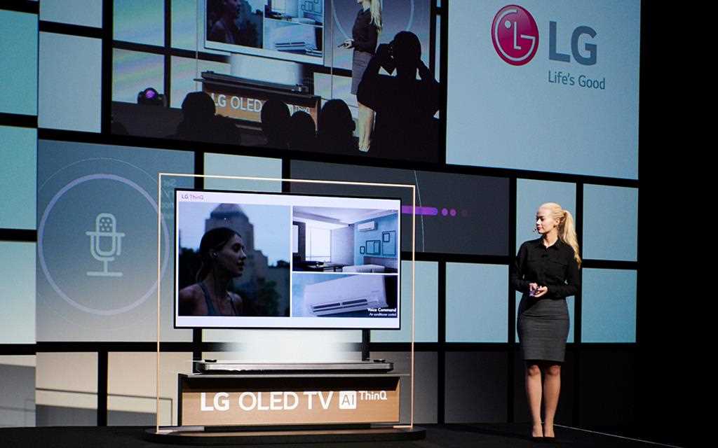 A woman demonstrating artificial intelligence within the LG OLED TV during LG IFA 2018 keynote speech.