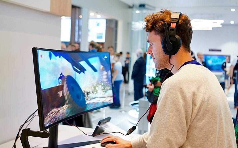 IFA 2018: A man playing video games on the 32GK850G LG Monitor in the gaming section of the exhibition