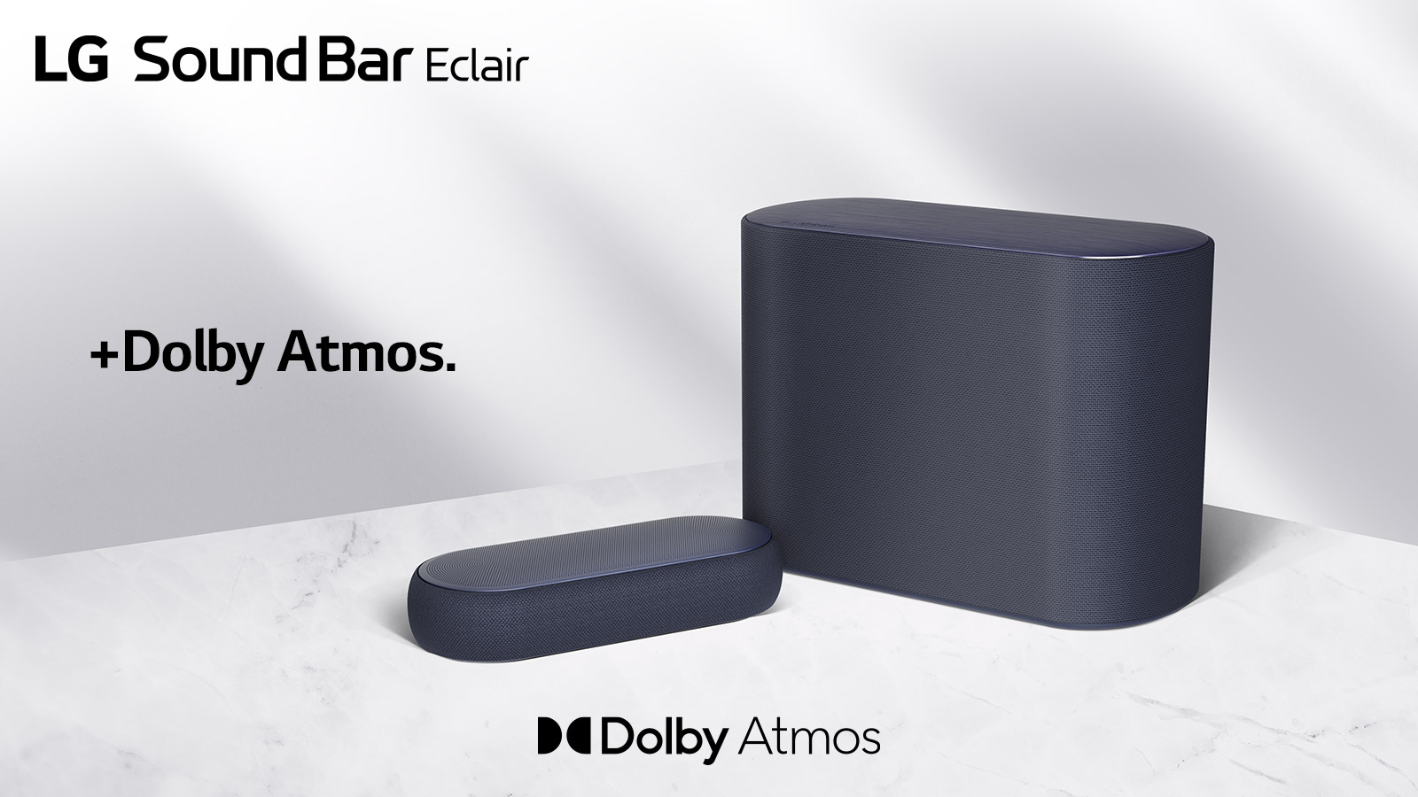 Una barra de sonido y un subwoofer se colocan en un piso de mármol, una barra de sonido y un subwoofer orientados hacia lados opuestos.