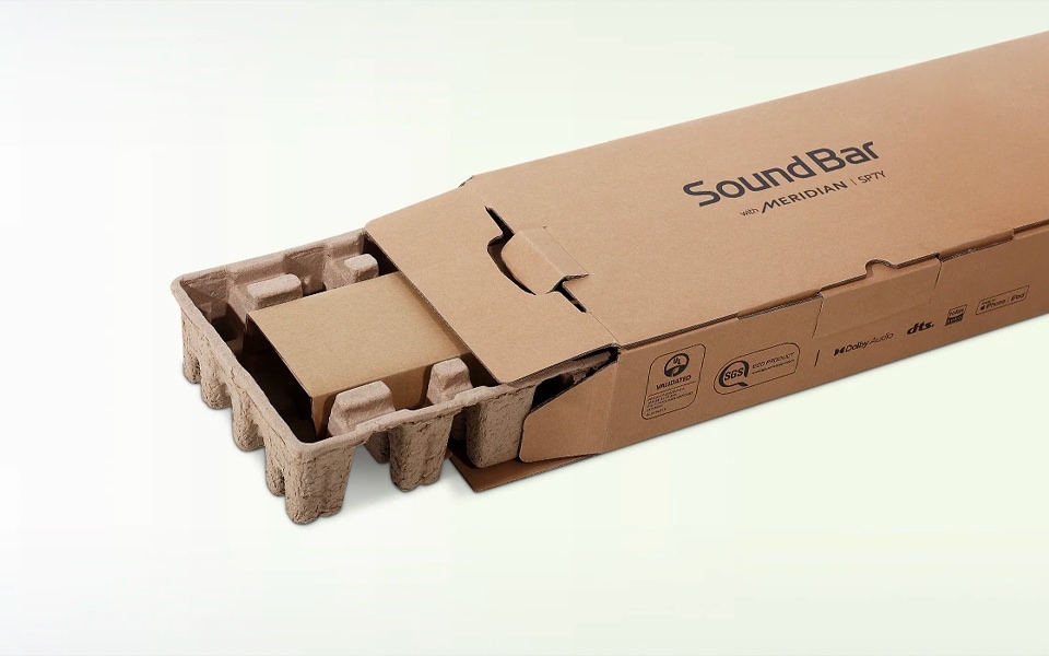 Recycled LG soundbar packaging sits open on a white surface