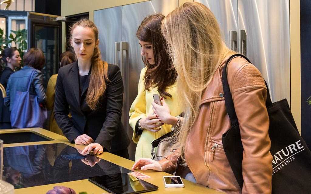 Guests look around the Signature Kitchen Suite, on show at Milan Design Week | More at LG MAGAZINE