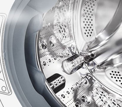 Kuva pesukoneen sisäpuolelta, jossa ruostumattomasta teräksestä valmistetut rummut näkyvät.