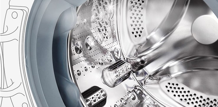 Kuva pesukoneen sisäpuolelta, jossa ruostumattomasta teräksestä valmistetut rummut näkyvät.