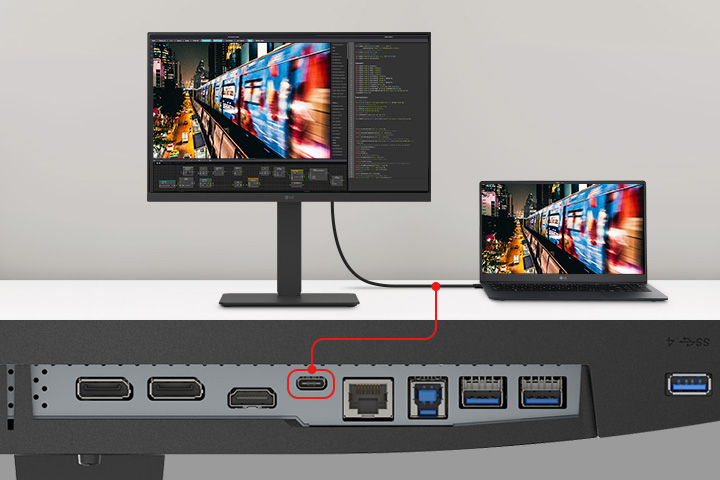 Kuva kannettavasta ja näytöstä, jotka on yhdistetty yhdellä USB Type-C-kaapelilla.