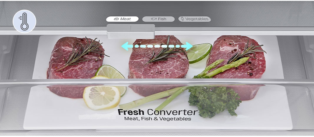 Lähikuva lihatuotteilla täytetystä Fresh Converter -laatikosta, jossa on lämpötilan valitsin&nbsp;liha-, kala- ja vihannestuotteille. Laatikon lämpötilan taso on asetettu lihatuotteille sopivaksi.