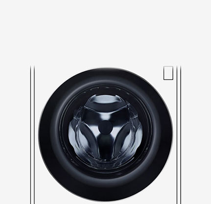 Kuva pesukoneen sisäpuolelta, jossa ruostumattomasta teräksestä valmistetut rummut näkyvät.