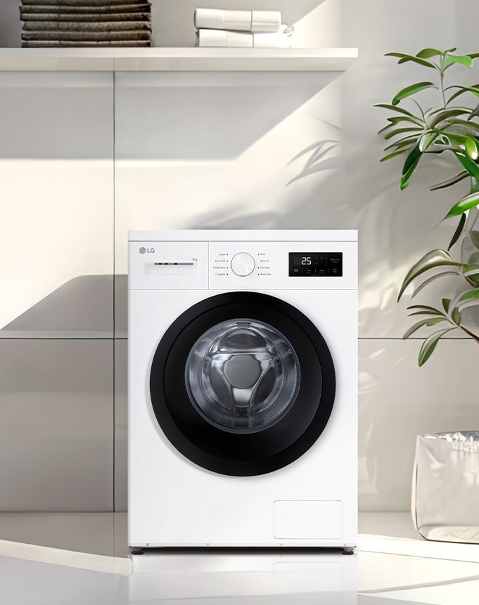  Edestä täytettävä pesukone moderniin pyykinpesutilaan asetettuna