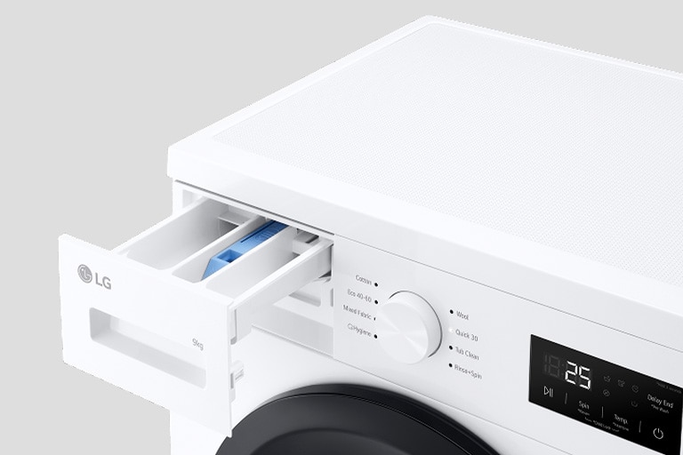 Lähikuva pesukoneen rummusta, jonka ovi on auki