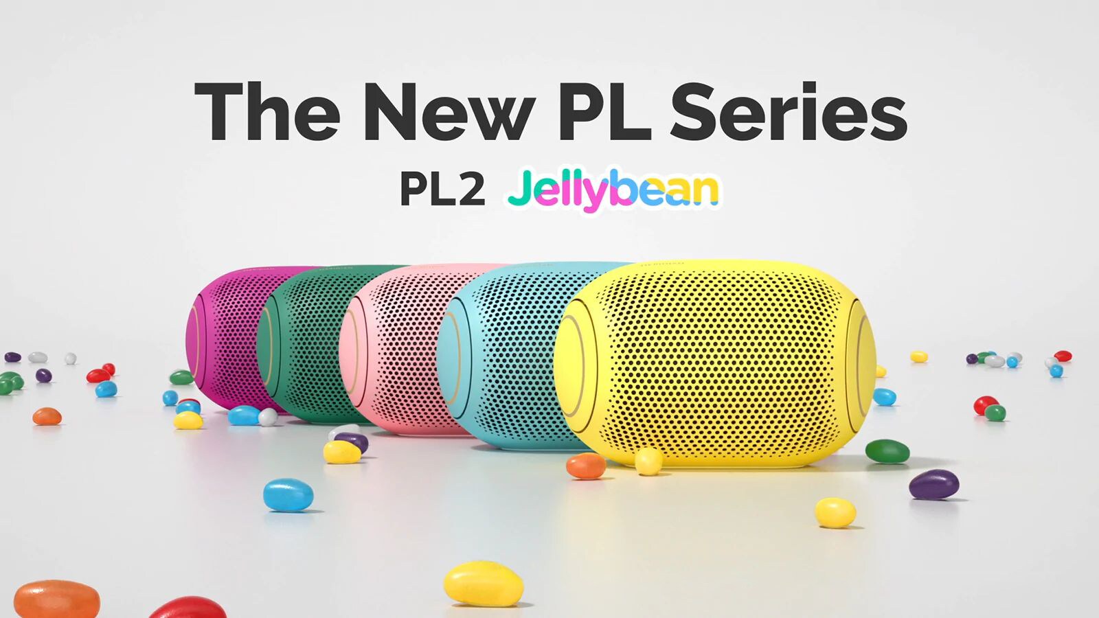 A front view of five colored jelly beans lined up behind each other.