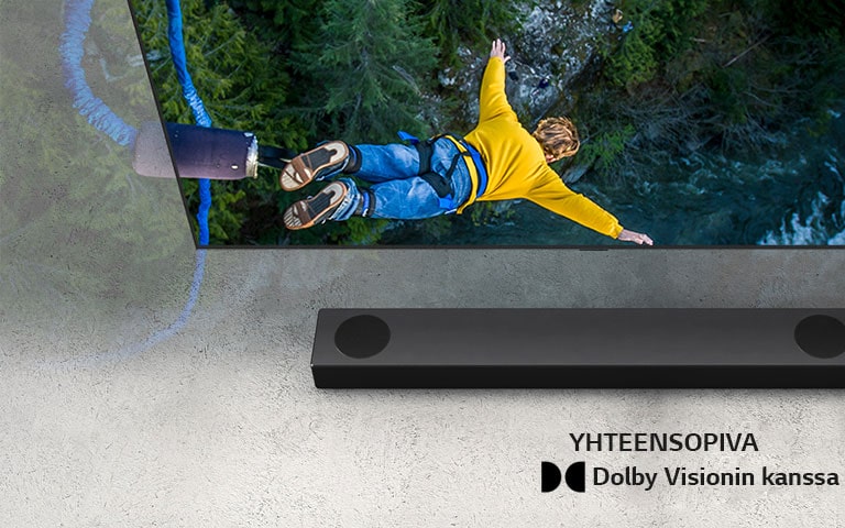 "LG:n televisiossa näkyy henkilö hyppäämässä benjihyppyä, ja LG Sound Bar on sijoitettu  television alapuolelle."