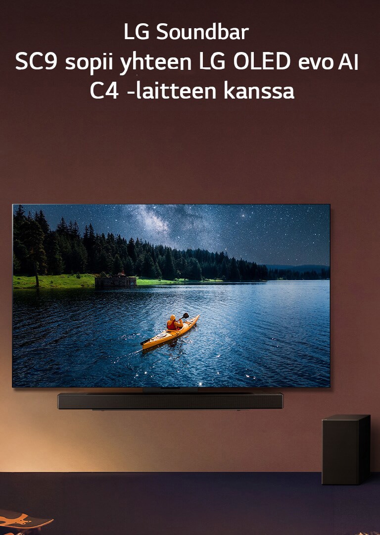 LG TV ja Soundbar on asennettu seinälle, ja subwoofer on lattialla oikealla. Televisiossa on ihminen järvellä kanootissa ja seinällä on himmeitä varjoja.