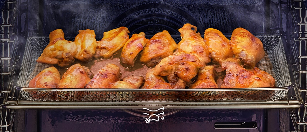 Tämä on kuva kiertoilmalla kypsennettävistä kanansiivistä.