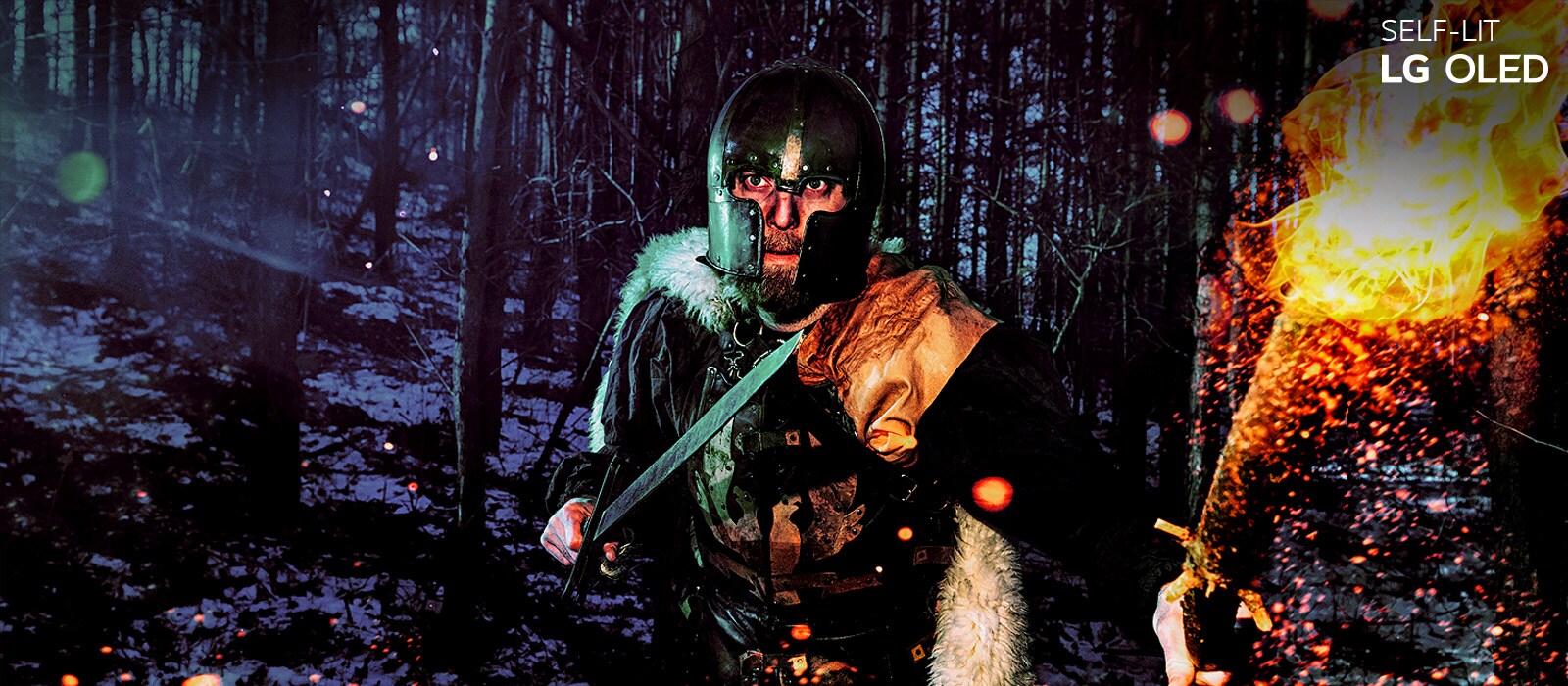 Slider comparison of a man wearing armor in the winter woods carrying a sword and torch (move the slide bar)