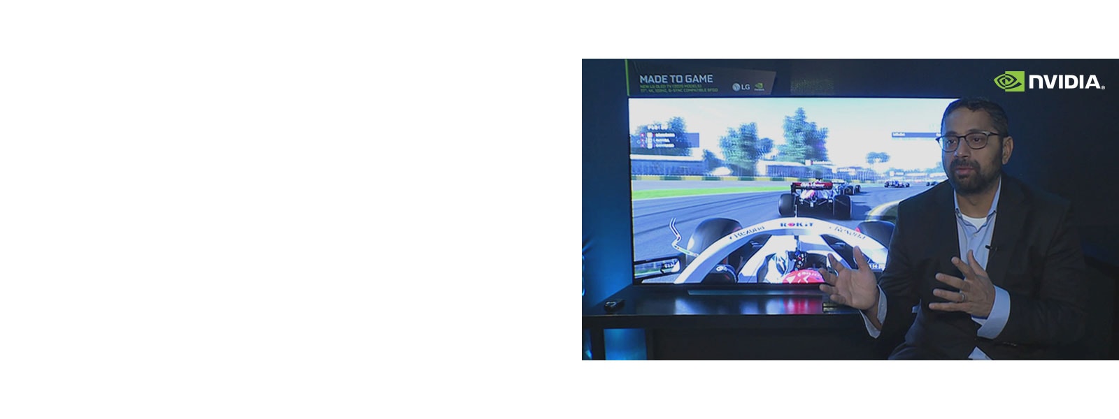Kaustubh Sanghani giving an explanation in front of a screen showing a racing game (play the video)