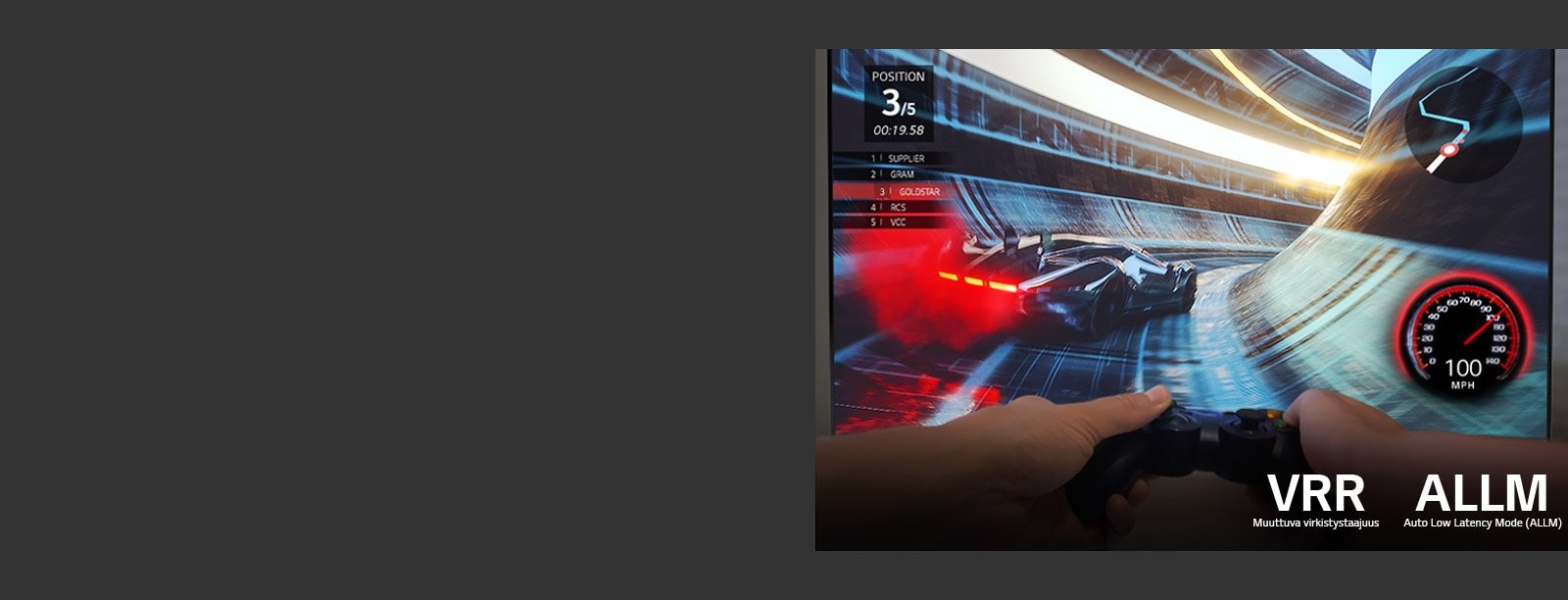 Screen of a racing game with two hands holding a game controller in front of it 