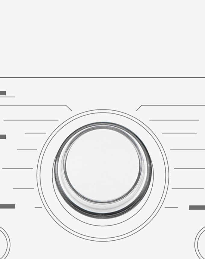 Tässä on suurennettu kuva pesukoneen käyttöpaneelin metallivalitsimesta.