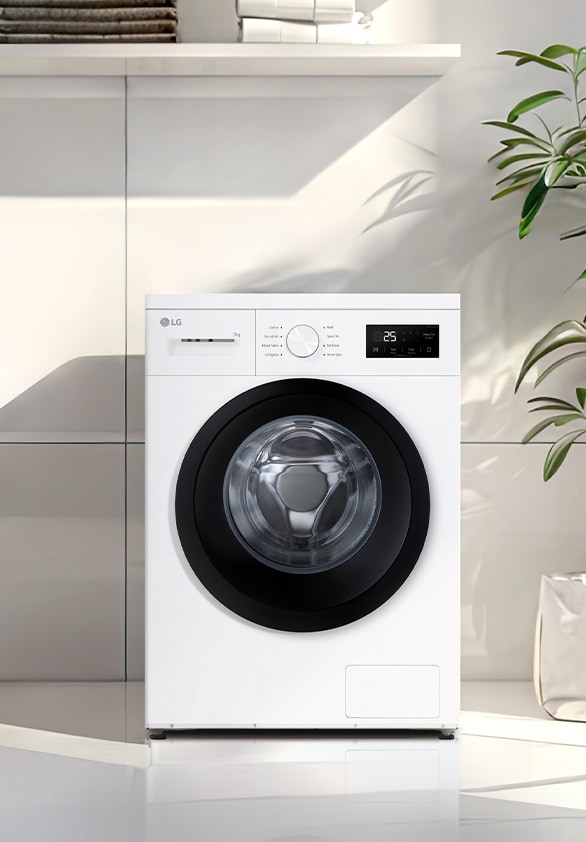  Edestä täytettävä pesukone moderniin pyykinpesutilaan asetettuna