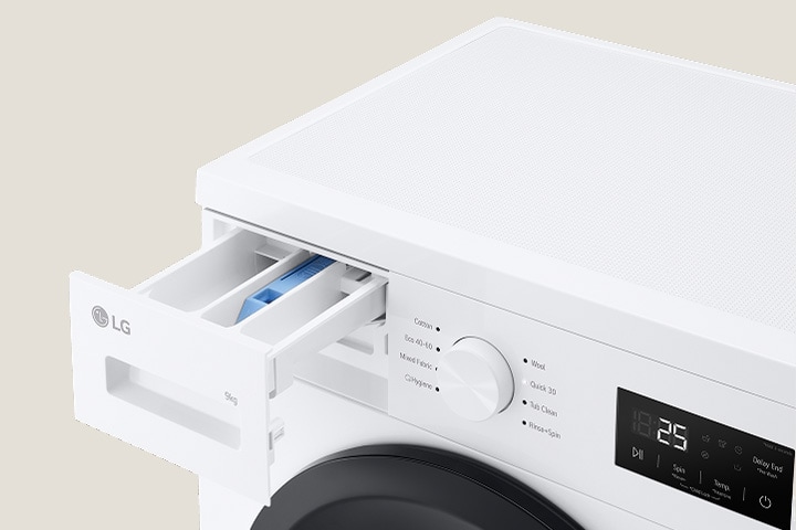 Lähikuva pesukoneen pyykkiainelokerosta.