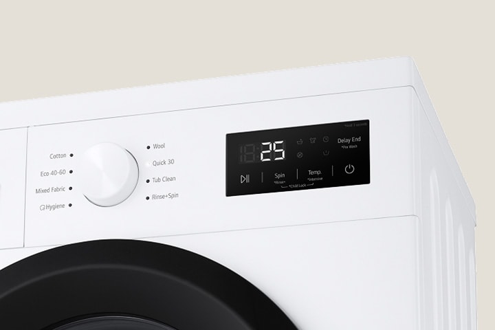 Lähikuva pesukoneen valitsimista ja paneelista