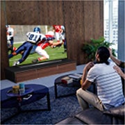 LG 77'' LG OLED 4K TV - CX, People watching a American football game on TV in the living room, OLED77CX6LA, thumbnail 11